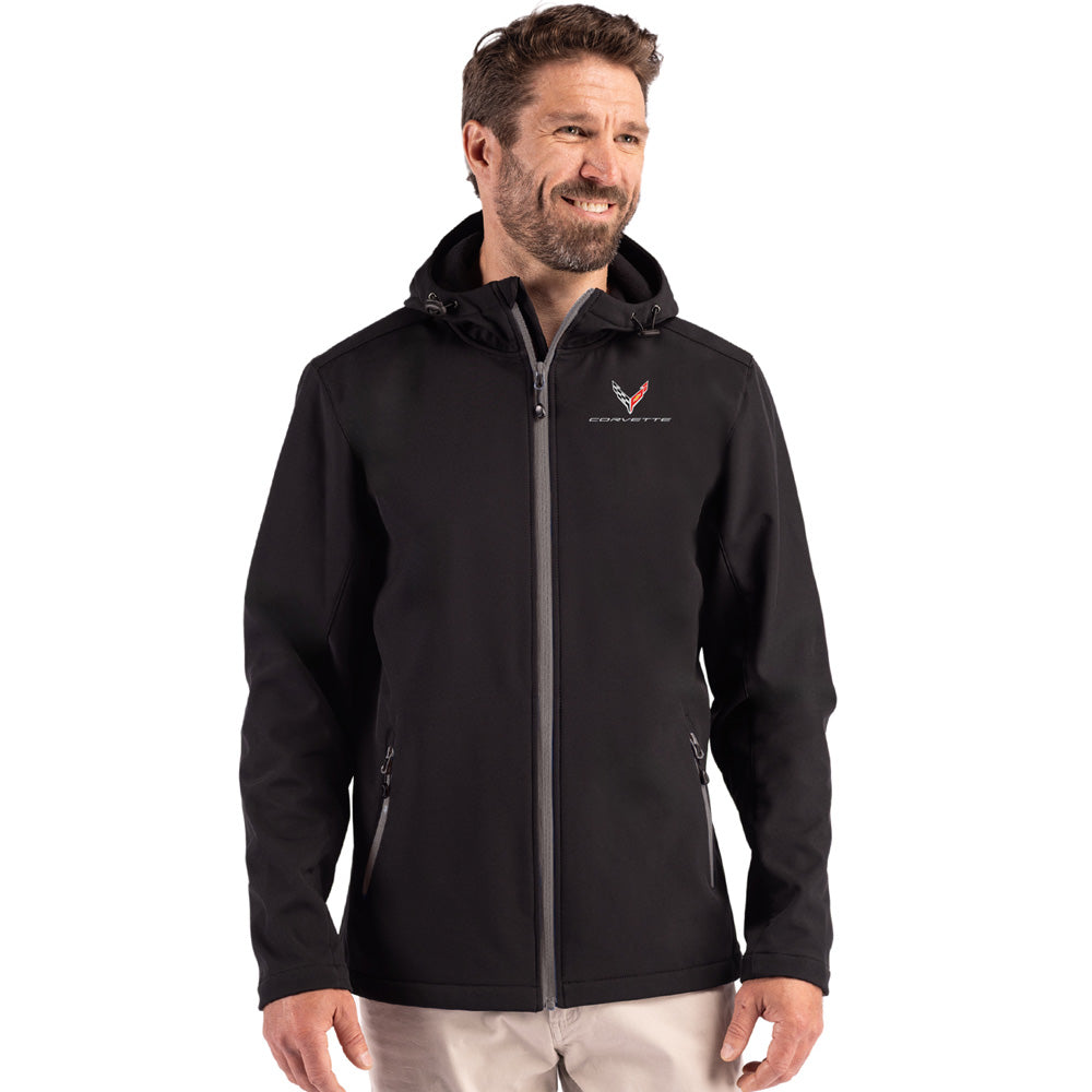 Man wearing a black C8 Corvette jacket on a white background