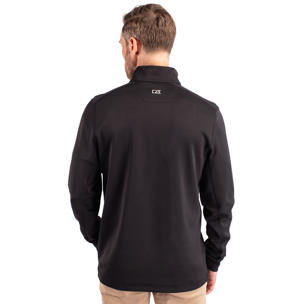 Man wearing a black pullover with a Cutter and Buck brand logo on the back against a white background