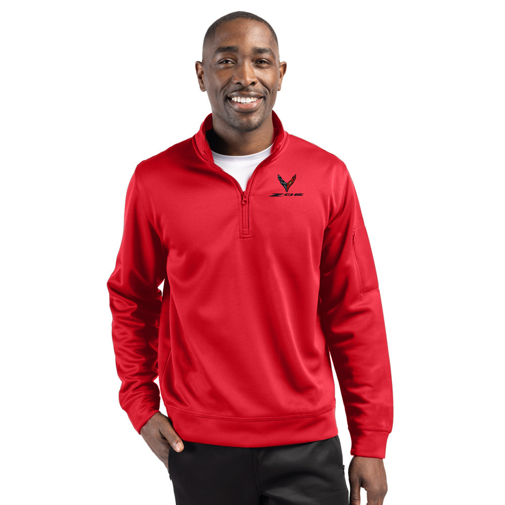 Man wearing a red quarter zip pullover with a C8 Z06 emblem on a white background