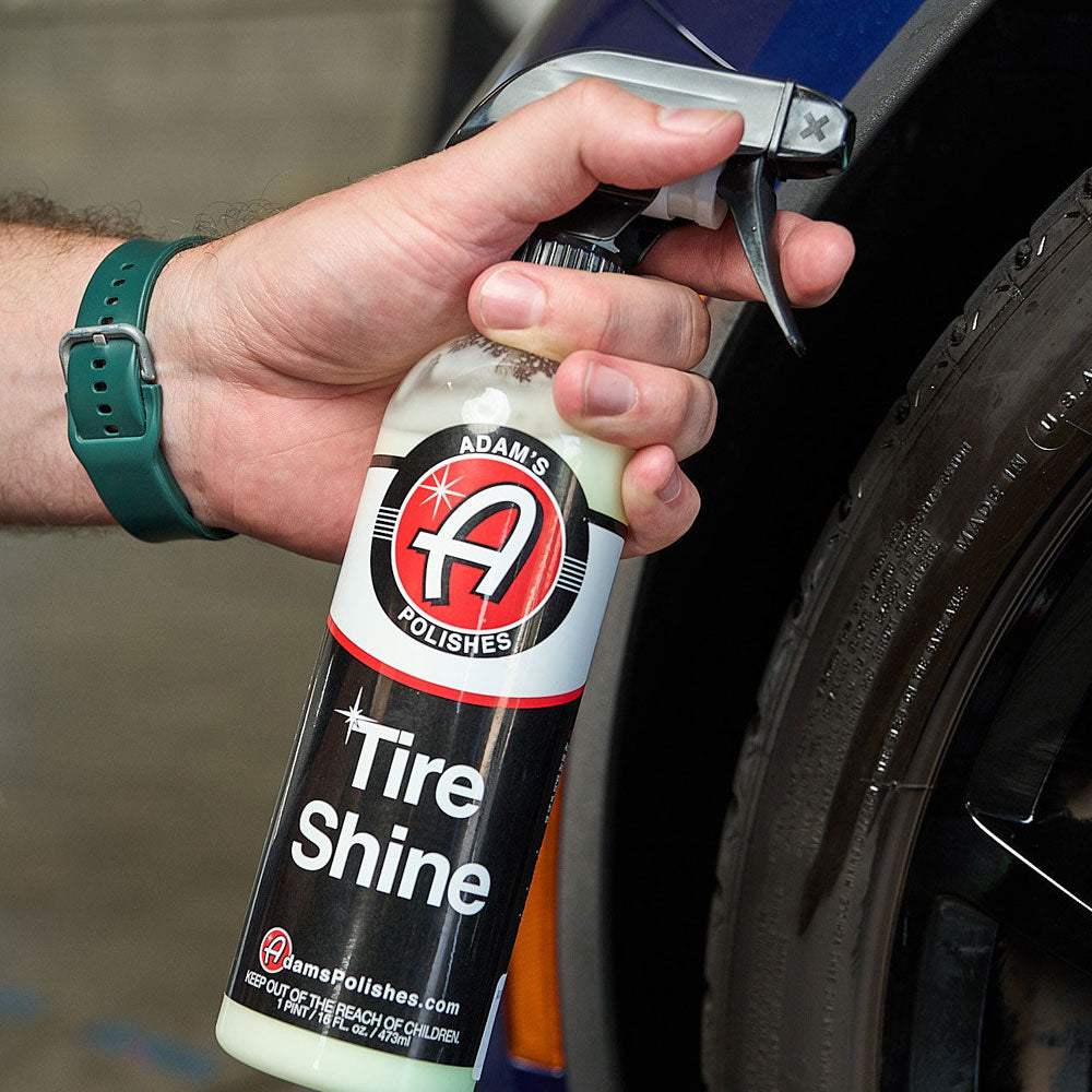 Adams Tire Shine spraying on a tire
