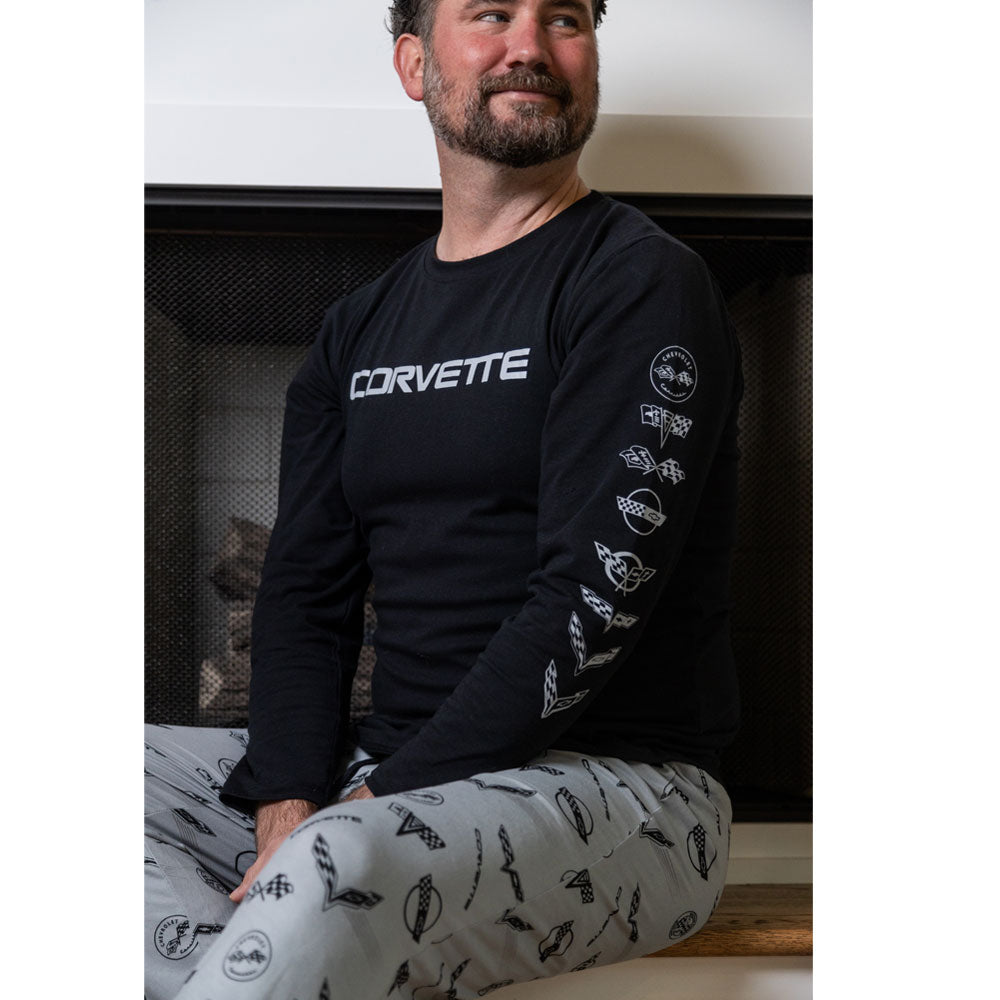 Man wearing the C1-C8 Corvette Emblems Long Sleeve Black Tee 