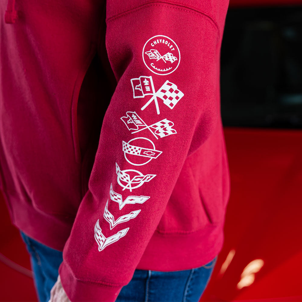 Close up of the C1-C8 emblems screen printed in white on the arm of the red Corvette sweatshirt.