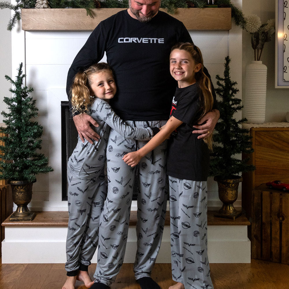 Youth standing with her dad and sister wearing the C1 through C8 Corvette Emblems Print Youth Gray Lounge Pant