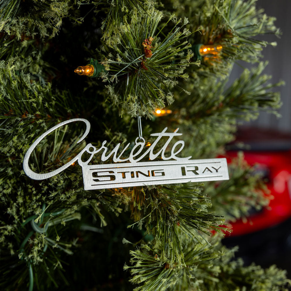 C2 Corvette Sting Ray Emblem Ornament shown hanging on a tree