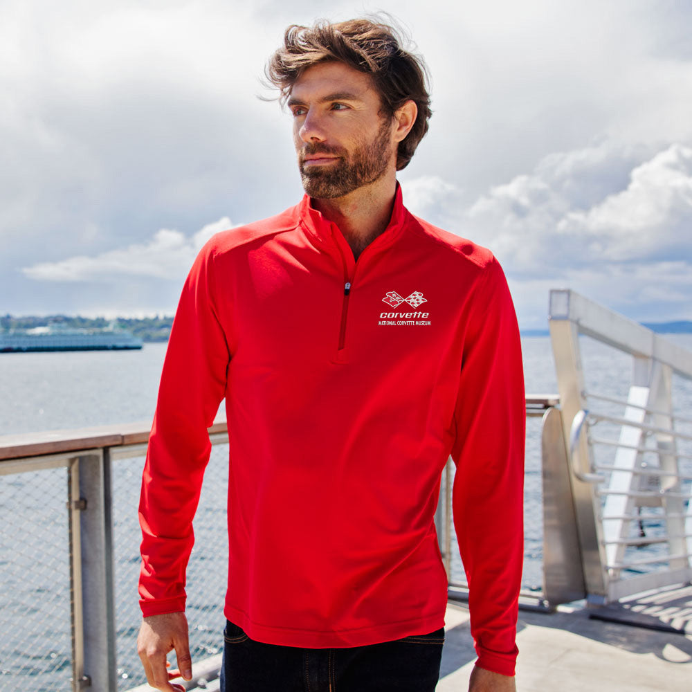 Man standing on a dock wearing the C3 Corvette Custom Virtue Eco Quarter-Zip Pullover in Red