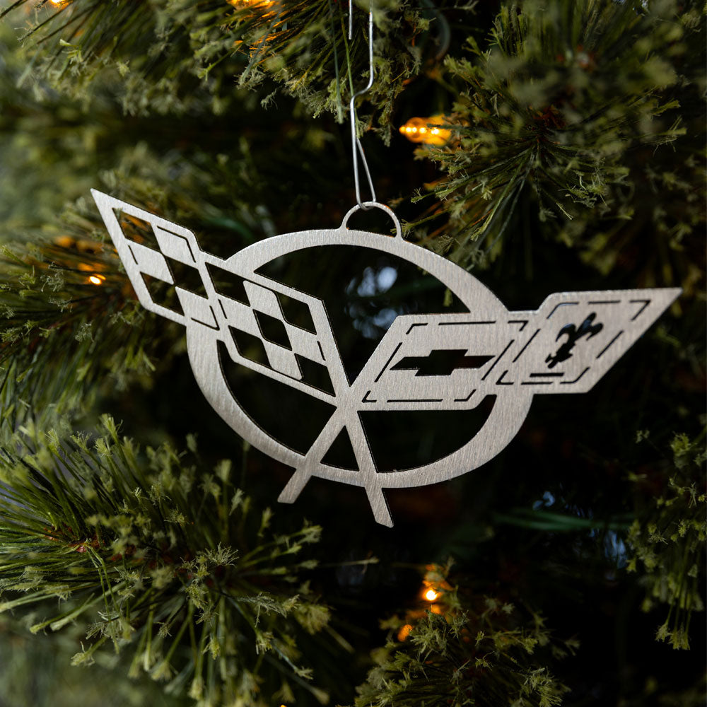 C5 Corvette Emblem Ornament shown hanging on a tree