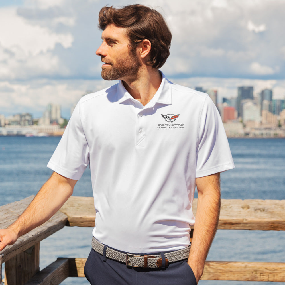 Man standing on a dock wearing the white C5 Corvette Custom Virtue Polo