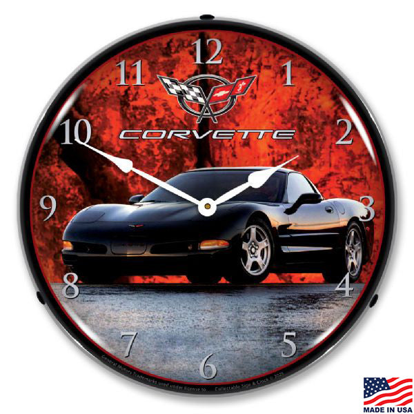 Wall clock showing a black C5 Corvette in front of a fiery red background