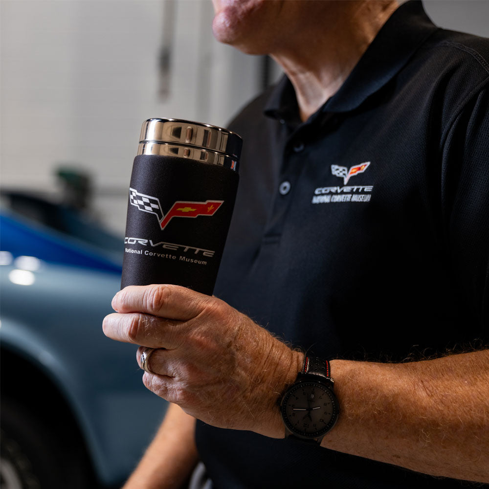 Man wearing a black C6 Corvette polo while drinking from the C6 Corvette Black Mugzie Travel Mug