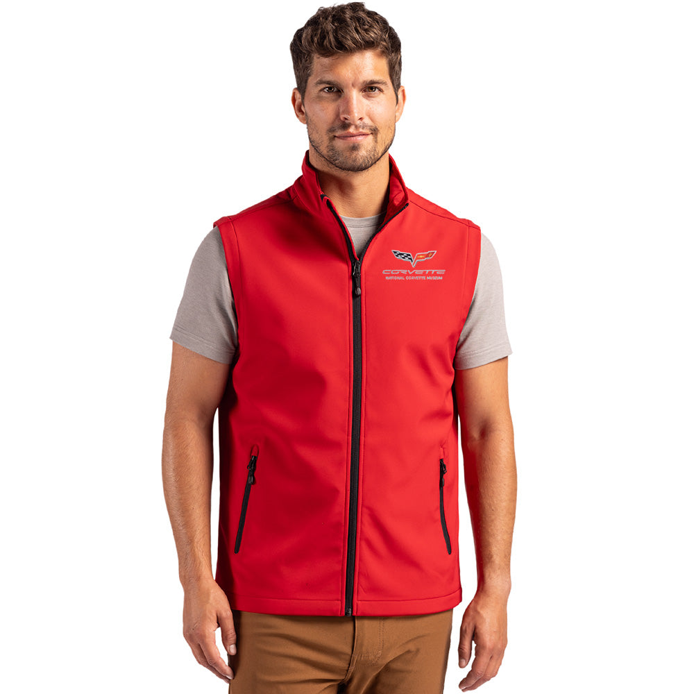 Man wearing a red vest with a C6 Corvette emblem on a white background