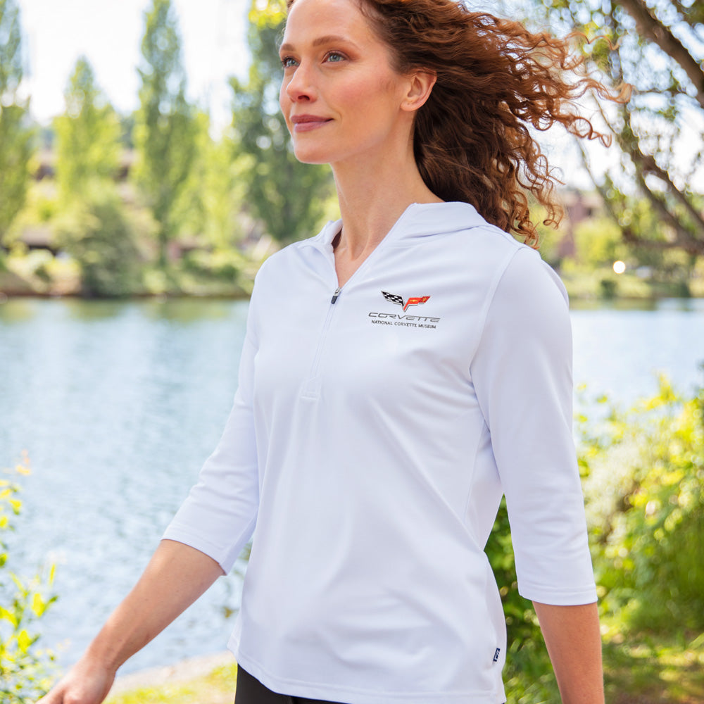Woman walking by a lake wearing the C6 Corvette Custom Virtue Eco Quarter Zip Pullover in White