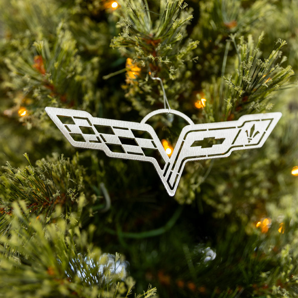 C6 Corvette Emblem Ornament shown hanging in a tree