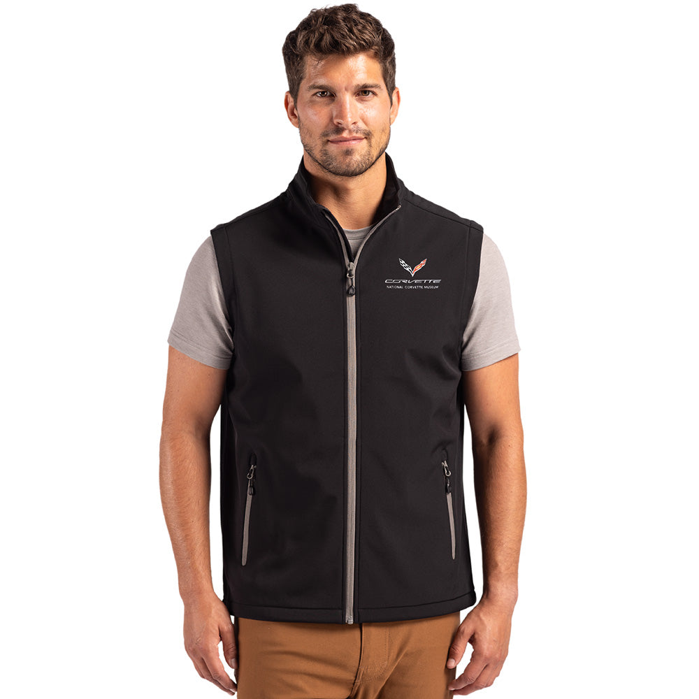 Man wearing a black vest with a C7 Corvette emblem on a white background