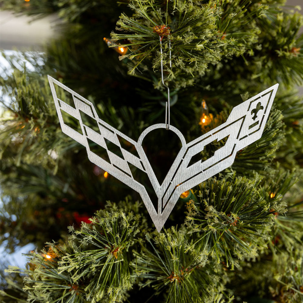 C7 Corvette Emblem Ornament shown hanging on a tree