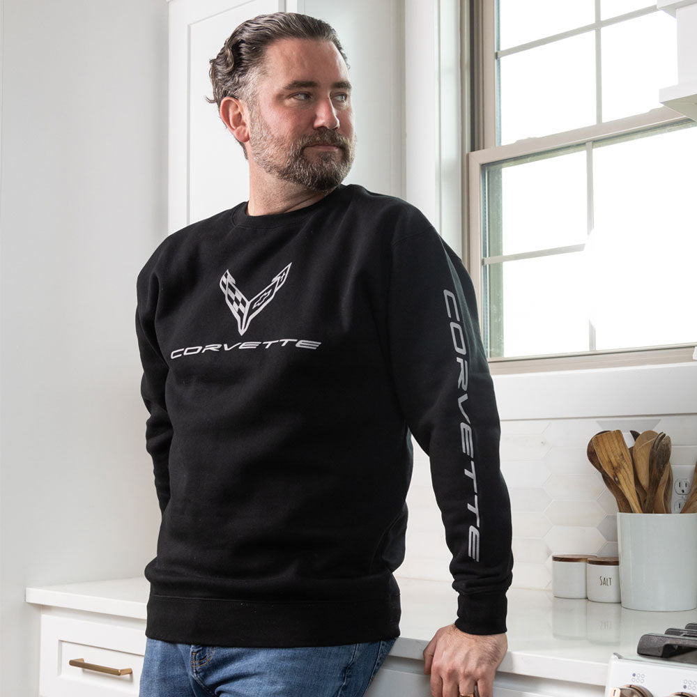 Man standing in a kitchen wearing the C8 Corvette Crew Black Sweatshirt