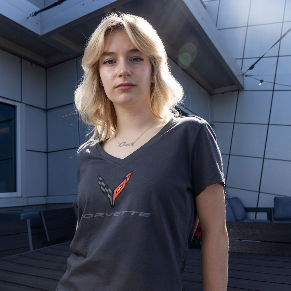 Woman wearing the C8 Corvette Emblem Ladies Graphite V-Neck Top 