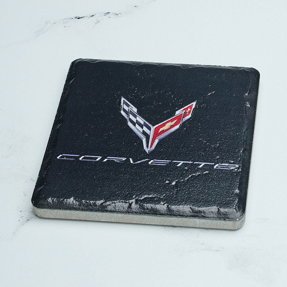 C8 Corvette Emblem Tile Coaster sitting on a table