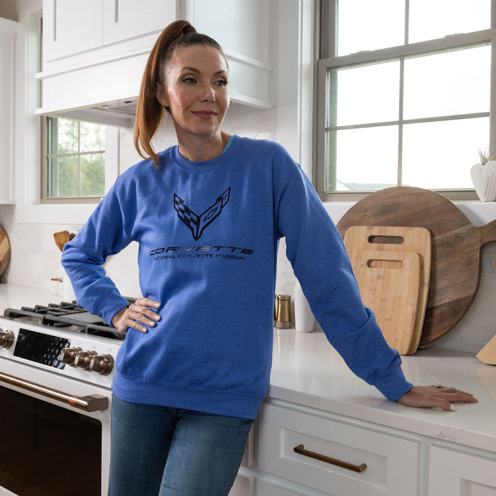 Women standing in a kitchen wearing the C8 Corvette Foil Emblem Classic Sweatshirt 