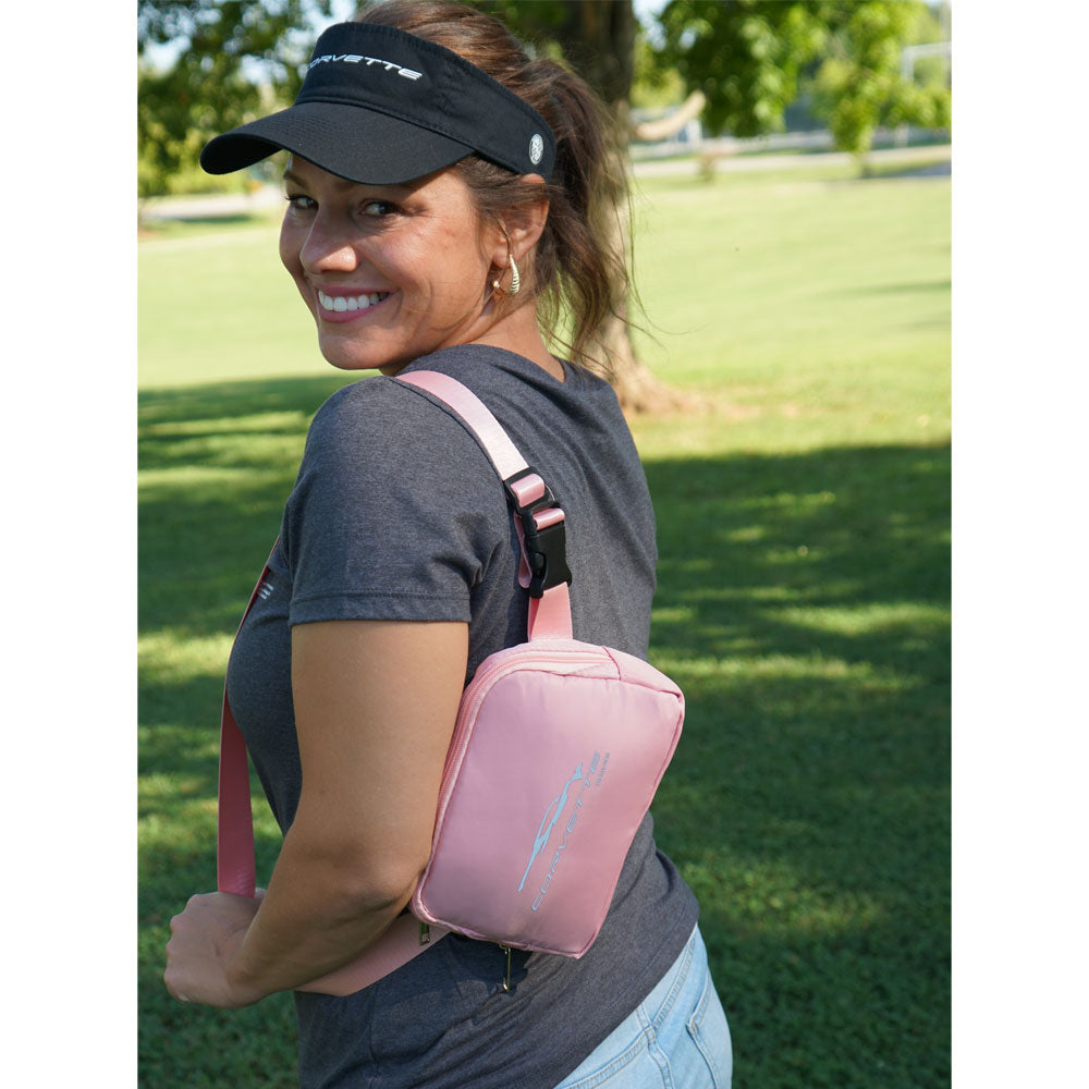 Woman wearing the C8 Corvette Gesture Pink Sling Belt Bag over her shoulder