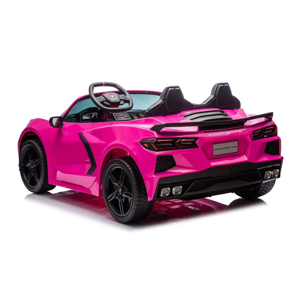 A bright pink children's ride-on toy  Corvette styled like a sports car, featuring black seats, wheels, and trim, shown on a clean white background.