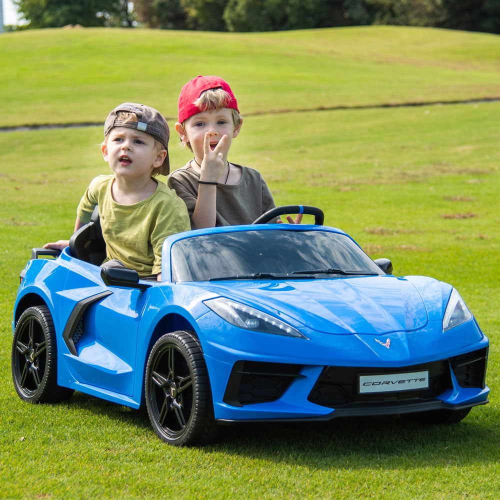 Two boys riding in the C8 Corvette Kids 24 Volt Electric Blue Ride On Car