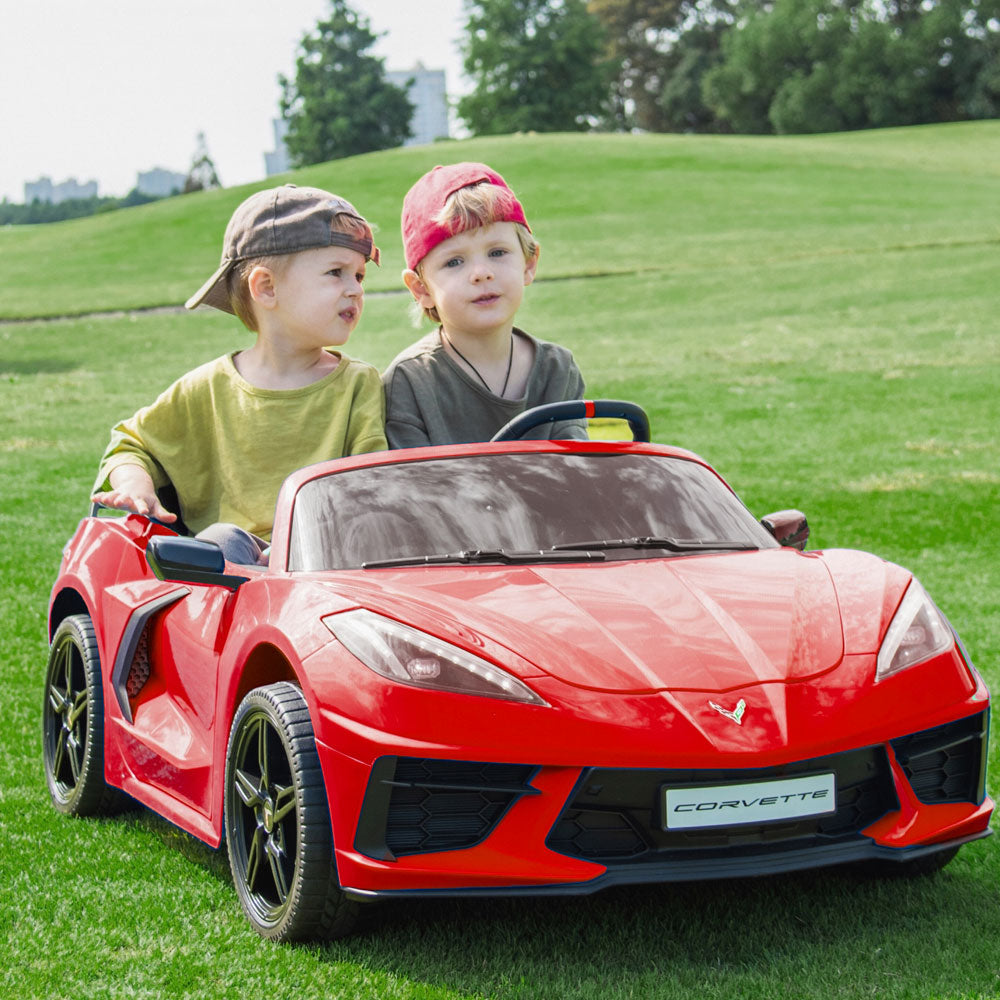 Two kids riding in the C8 Corvette Kids 24 Volt Electric Red Ride On Car