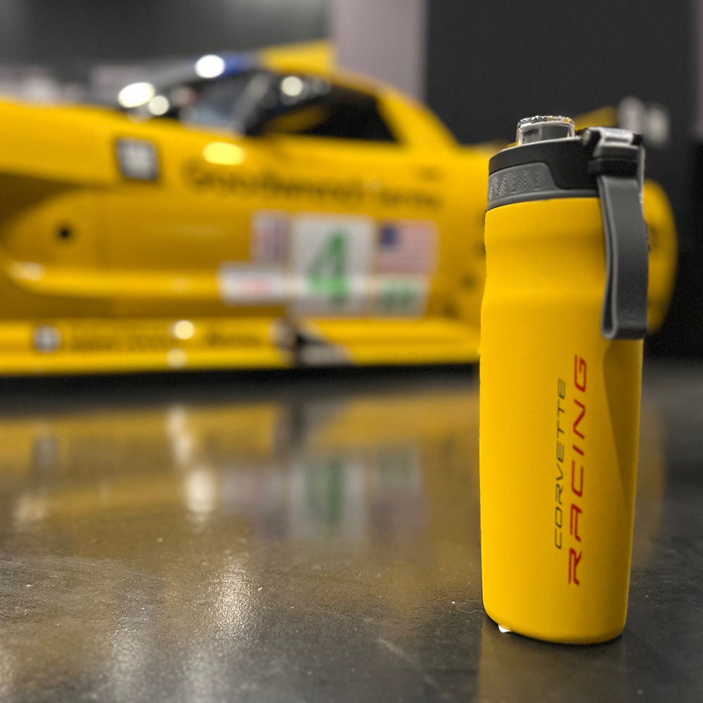 C8 Corvette Racing Yellow Thermal Bottle Sitting Next to a C8R Corvette