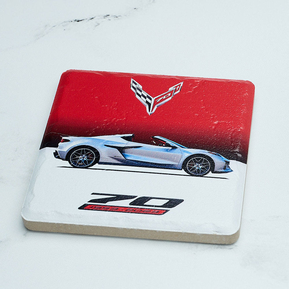 Corvette 70th Anniversary Coaster sitting on a table