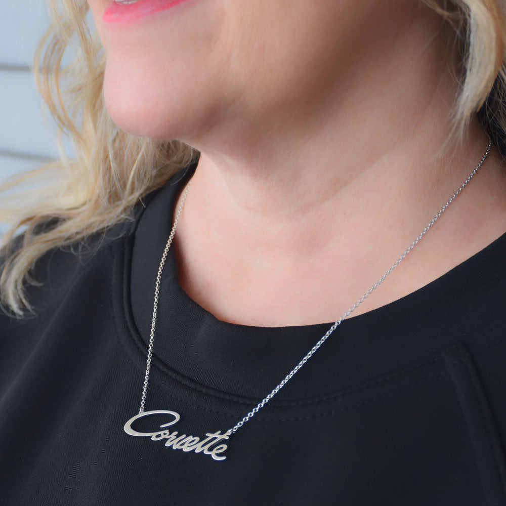 Woman wearing the Corvette Large Script Sterling Silver Necklace