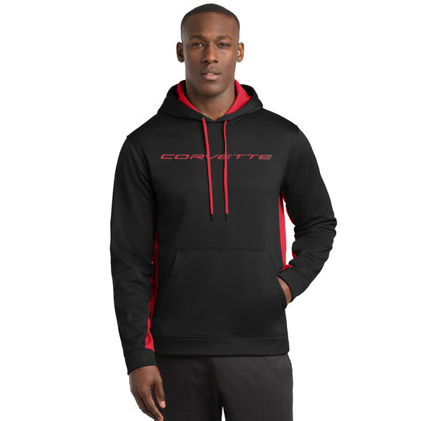 Person wearing a black hoodie with red accents and 'Corvette' script on a white background