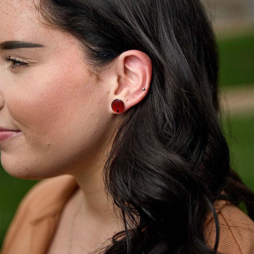 Woman wearing the Crash Jewelry Red Mist Crystal Stud Earrings