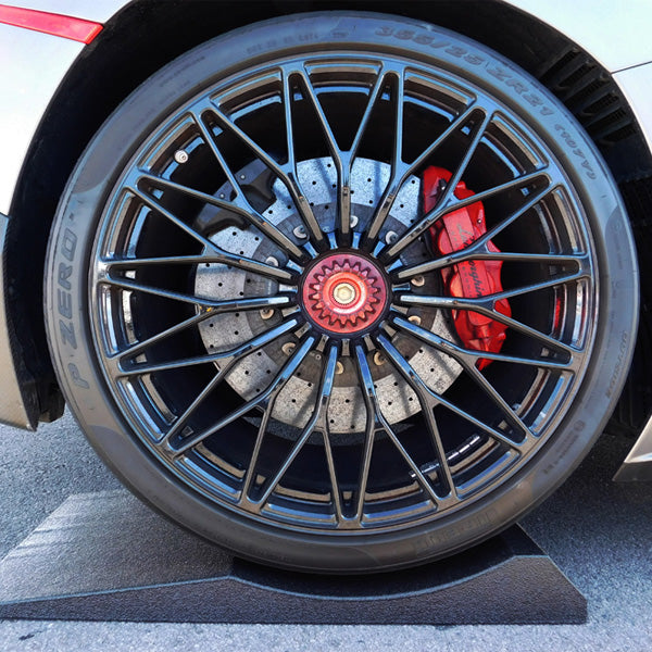 Car tire shown on a FlatStoppers Car Storage Ramp