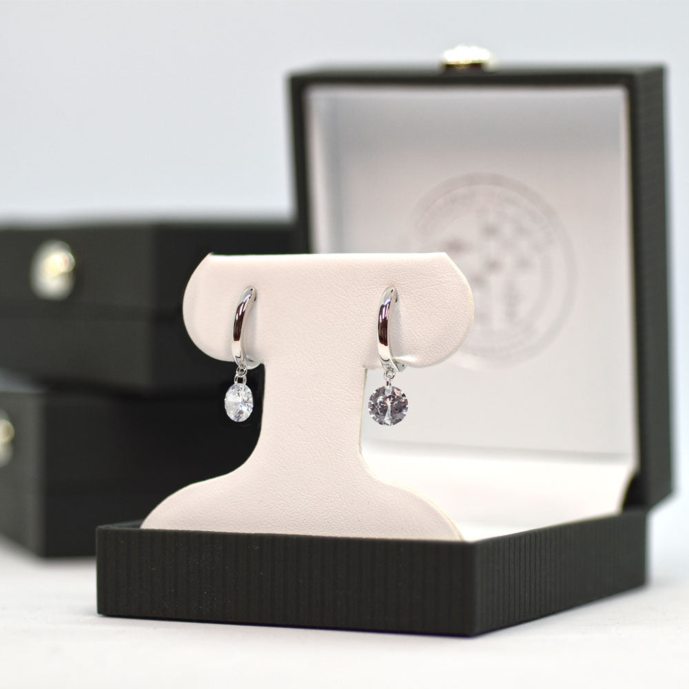 Hoop Earring Huggie with a Dangle CZ shown in a gift box