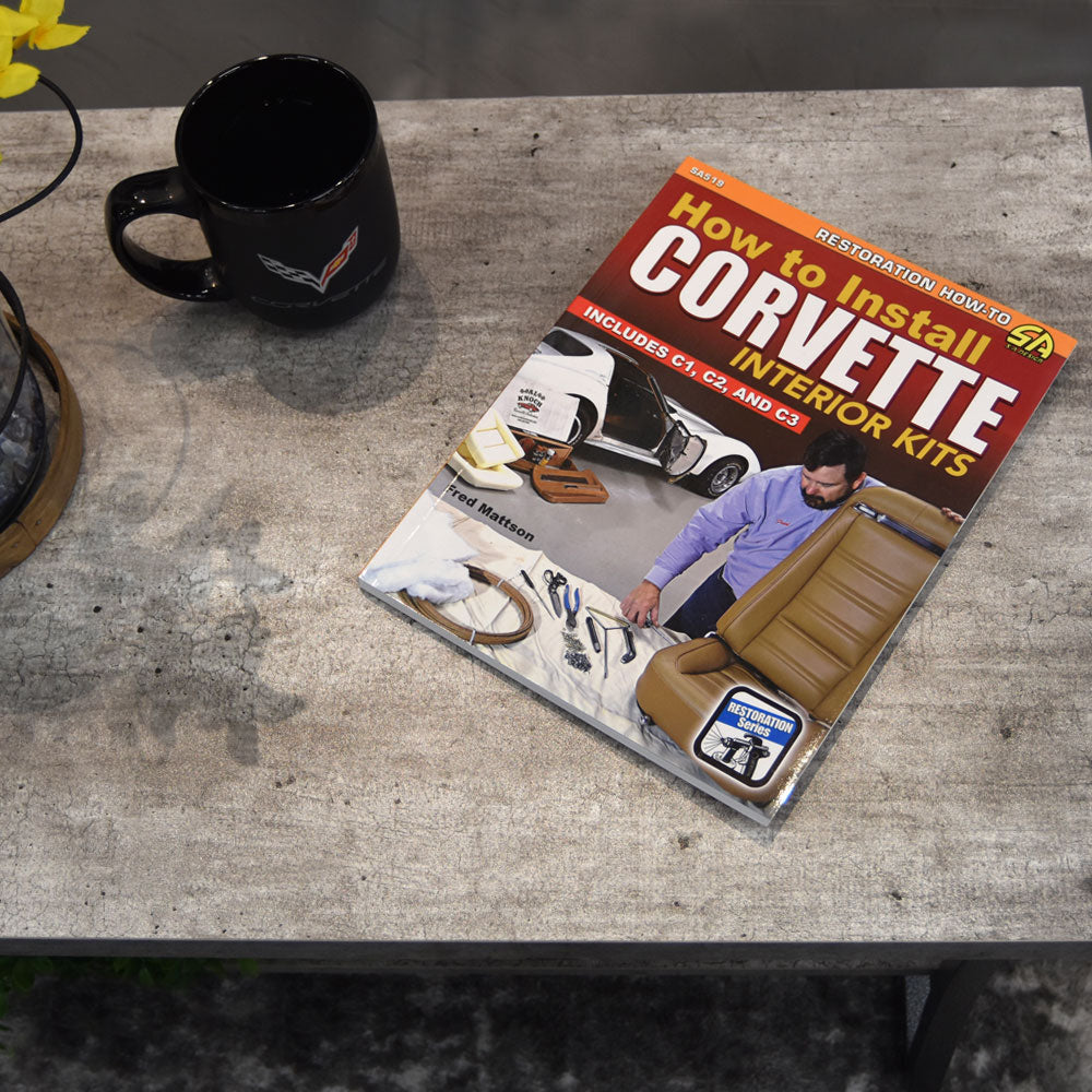 How to Install Corvette Interior Kits Paperback laying on a coffee table