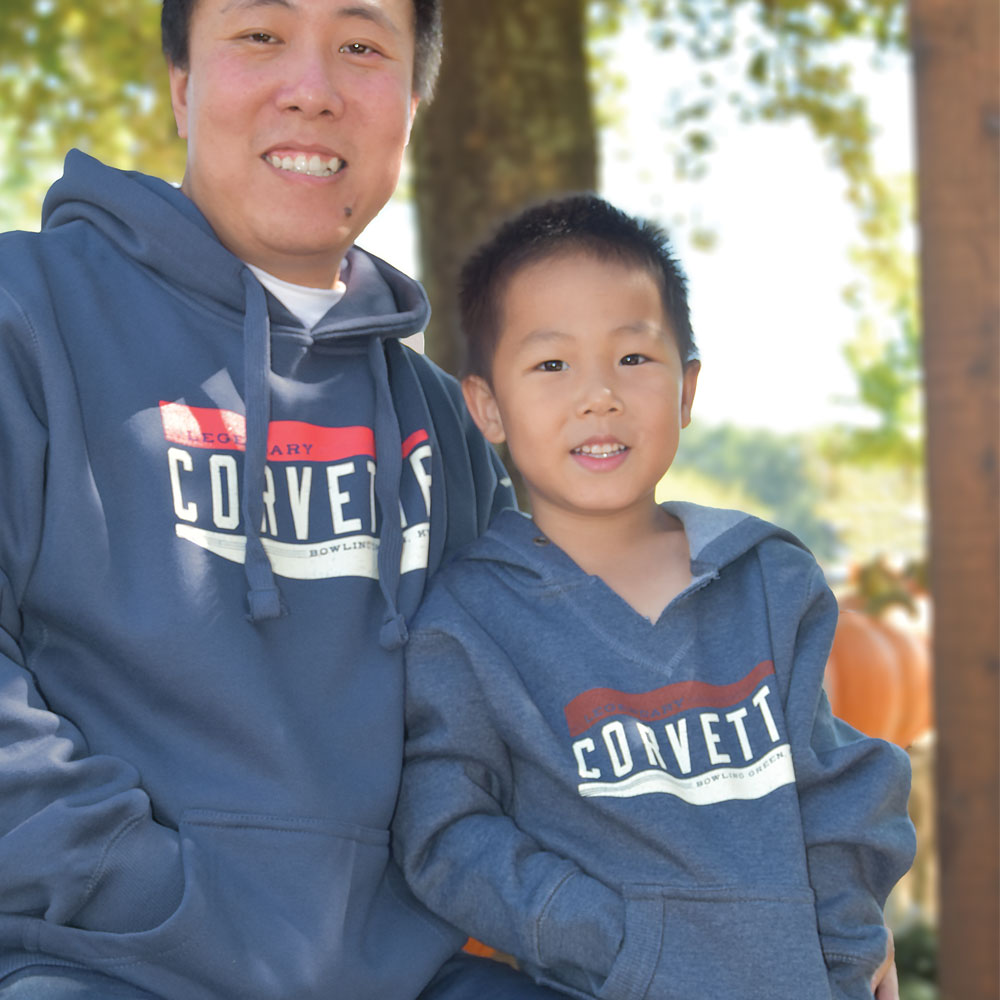 Man wearing the Legendary Corvette Heather Navy Heavyweight Hoodie next to his son in a matching sweatshirt