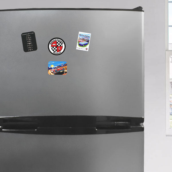 Variety of Corvette magnets shown on a refrigerator.