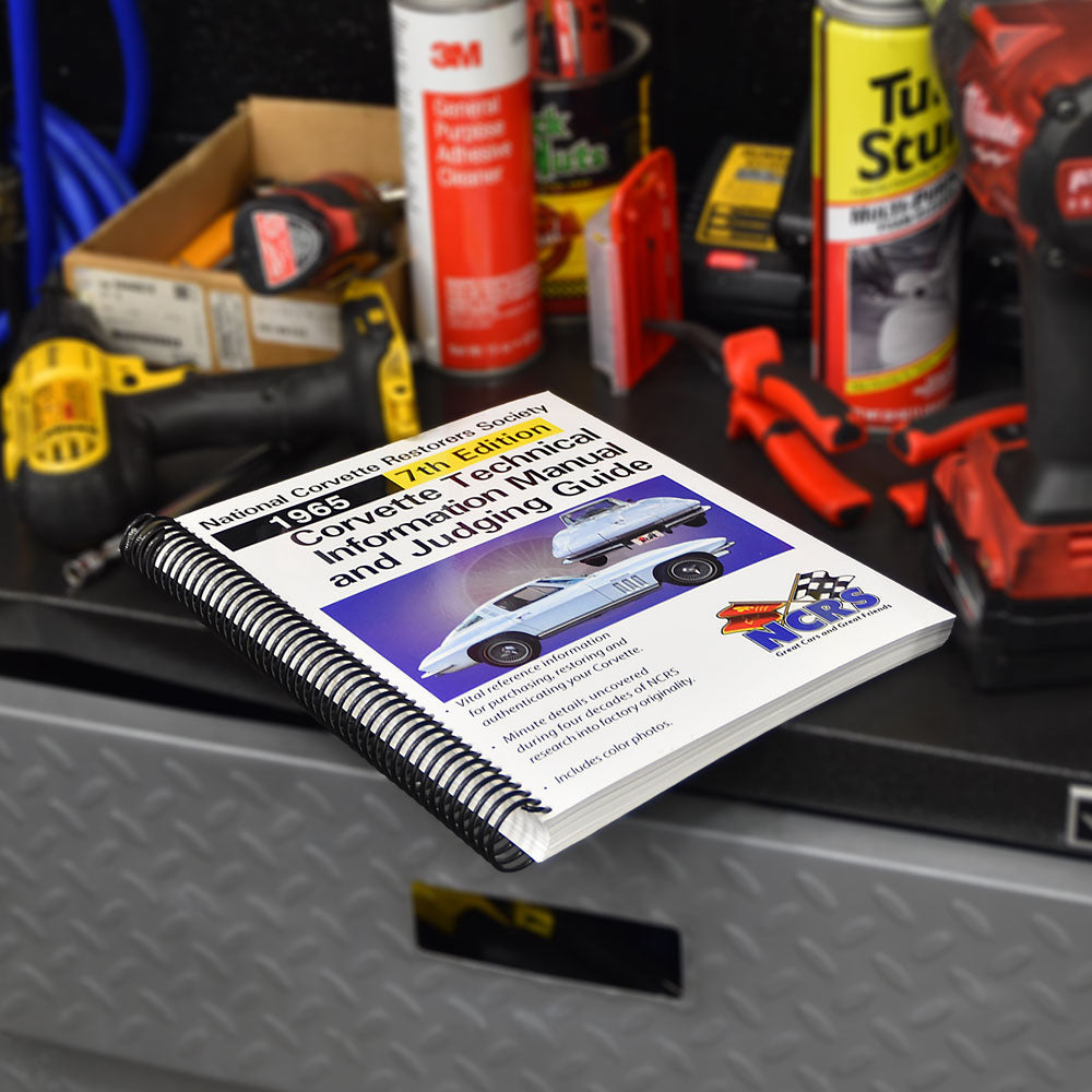 NCRS 1965 Corvette Technical Guide shown on top of a toolbox in a garage