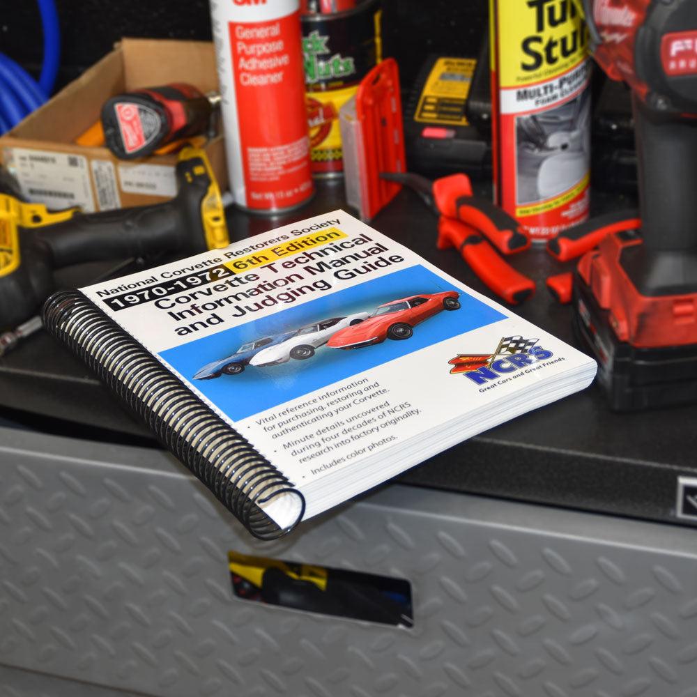 NCRS 1970-1972 Corvette Technical Guide shown laying on a toolbox in a garage