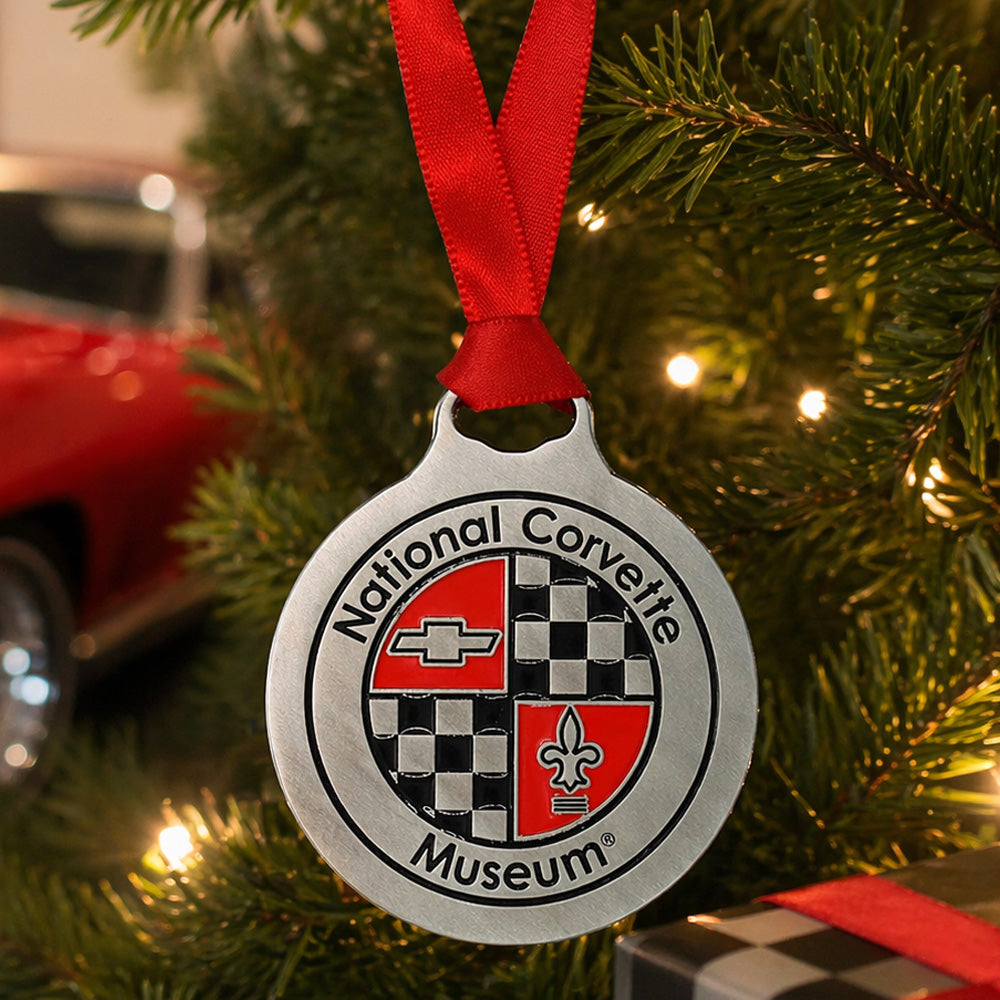 National Corvette Museum ornament on a Christmas tree with a red ribbon.