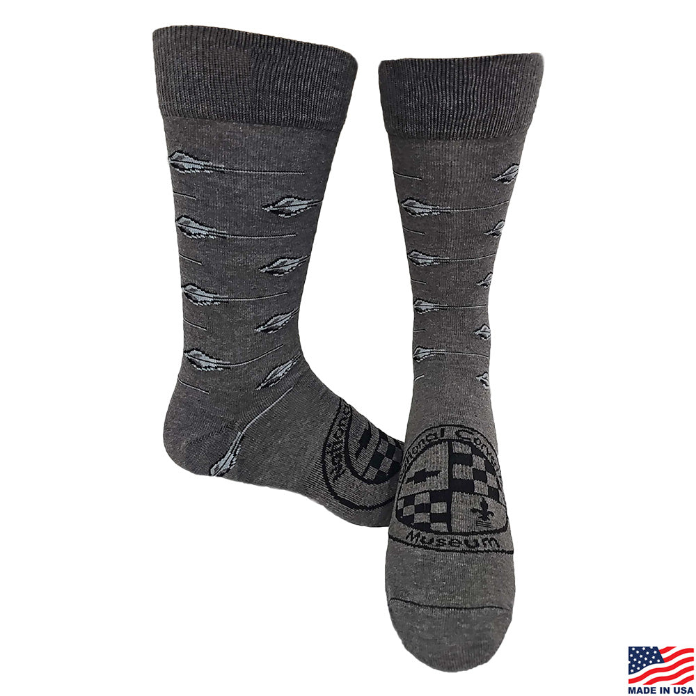 Pair of gray socks with a Corvette Stingray pattern shown on a white background